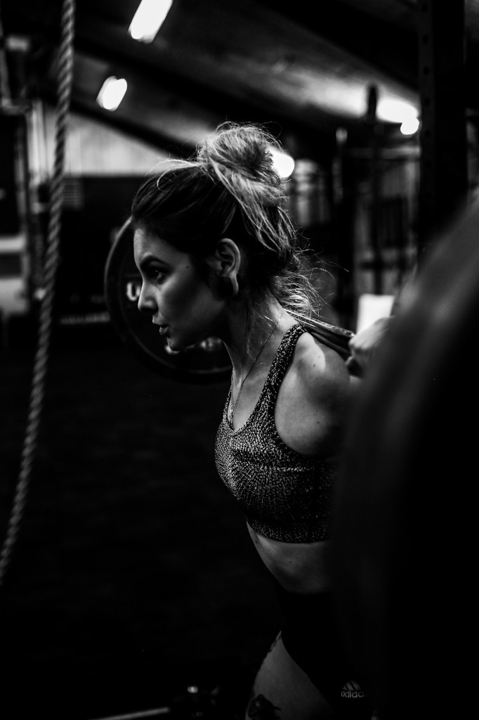 Athlete preparing to squat with a barbell
